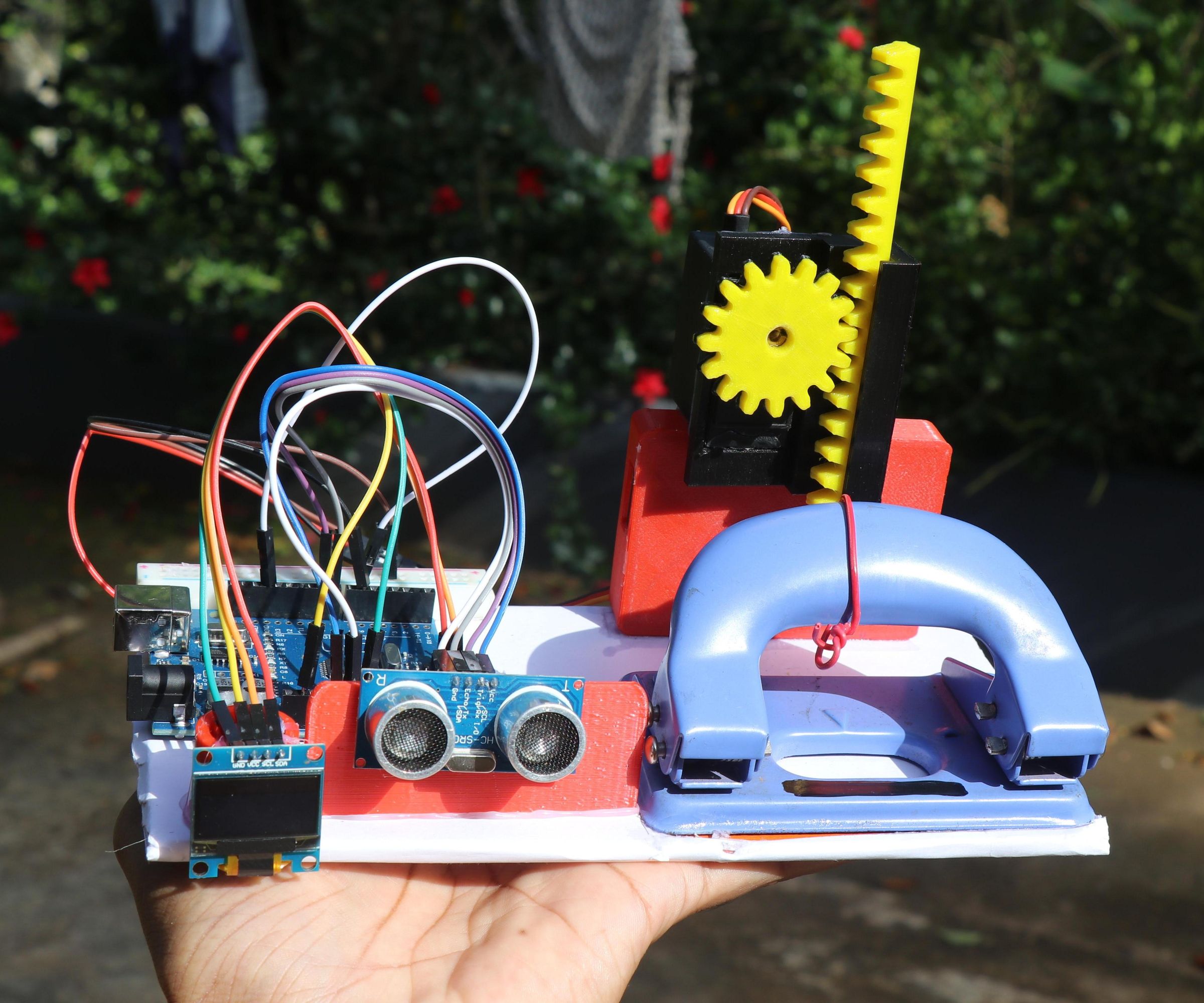 Automatic Paper Hole Punch Device Using Arduino