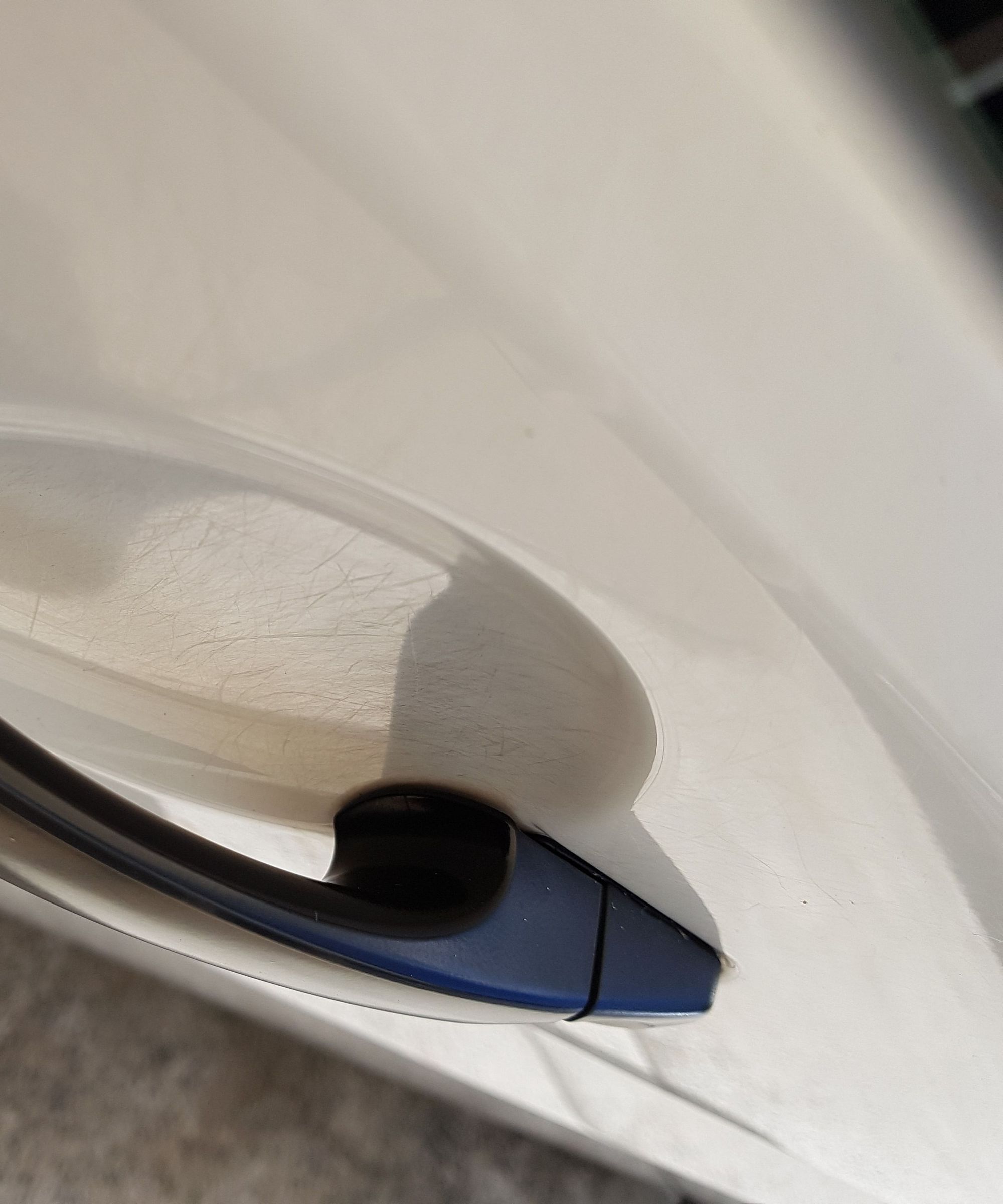 How to Polish Scratches From Under Your Car Door Handles