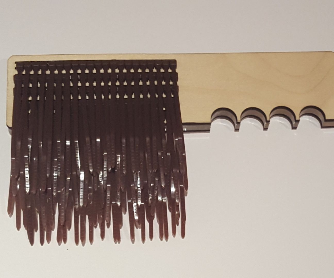 Zip tie multi-use brush, made with laser cutter.