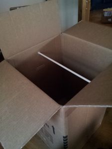 Step 2: Stick the Wood Pole Through Both Holes