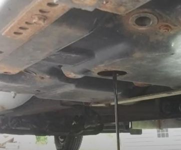 Drain Oil Into the Catch Pan