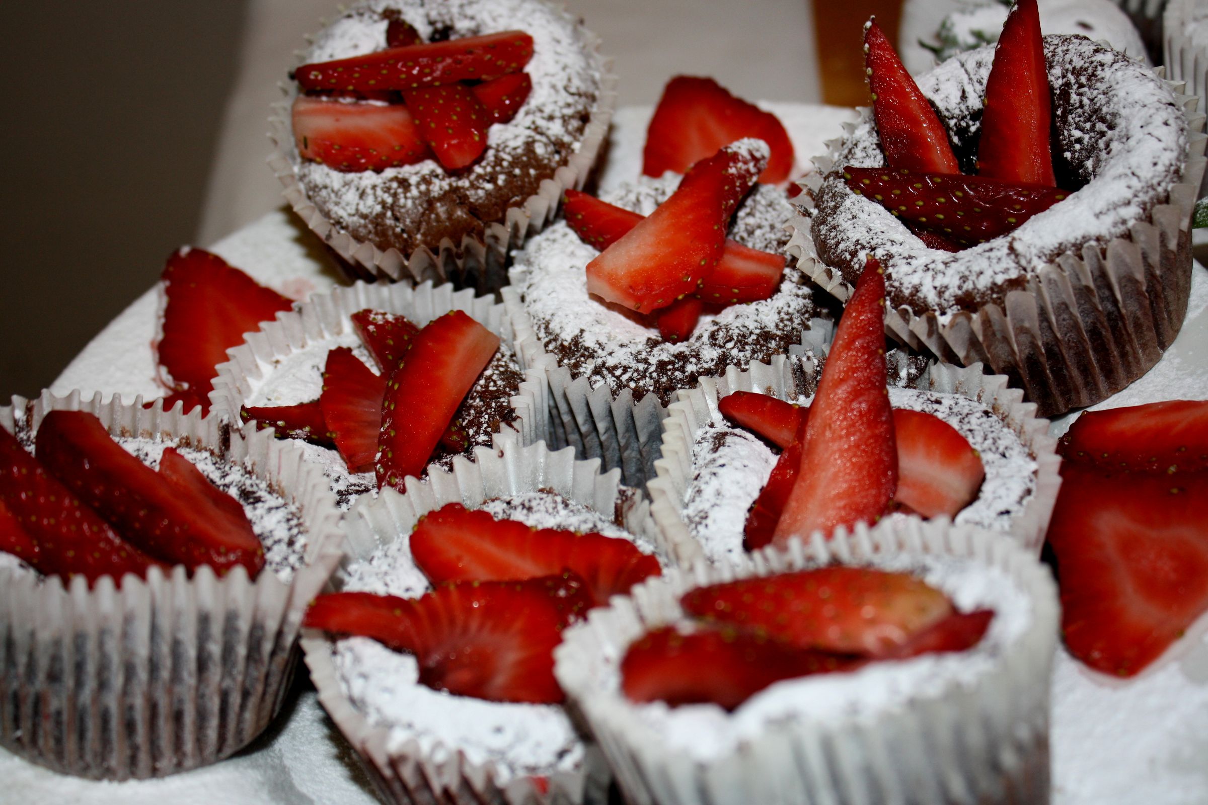 Chocolate Molten Cupcake With Powdered Sugar & Strawberries