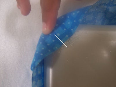 Glue Fabric Onto the Bottom Corners of the Wipe Box