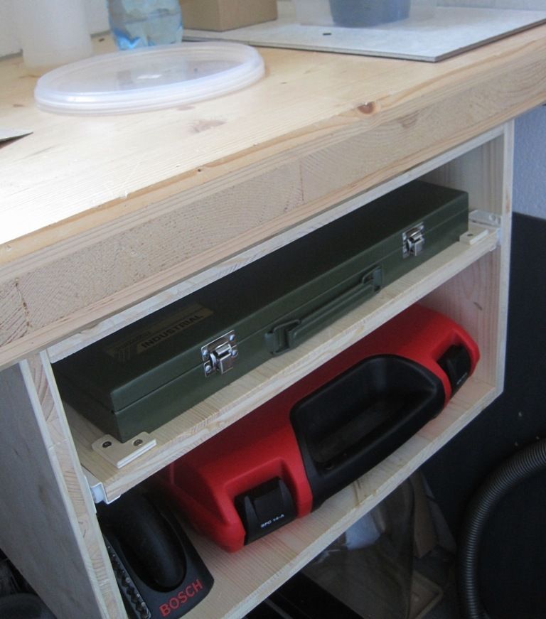 Workbench toolbox drawer with a storage shelf at the bottom