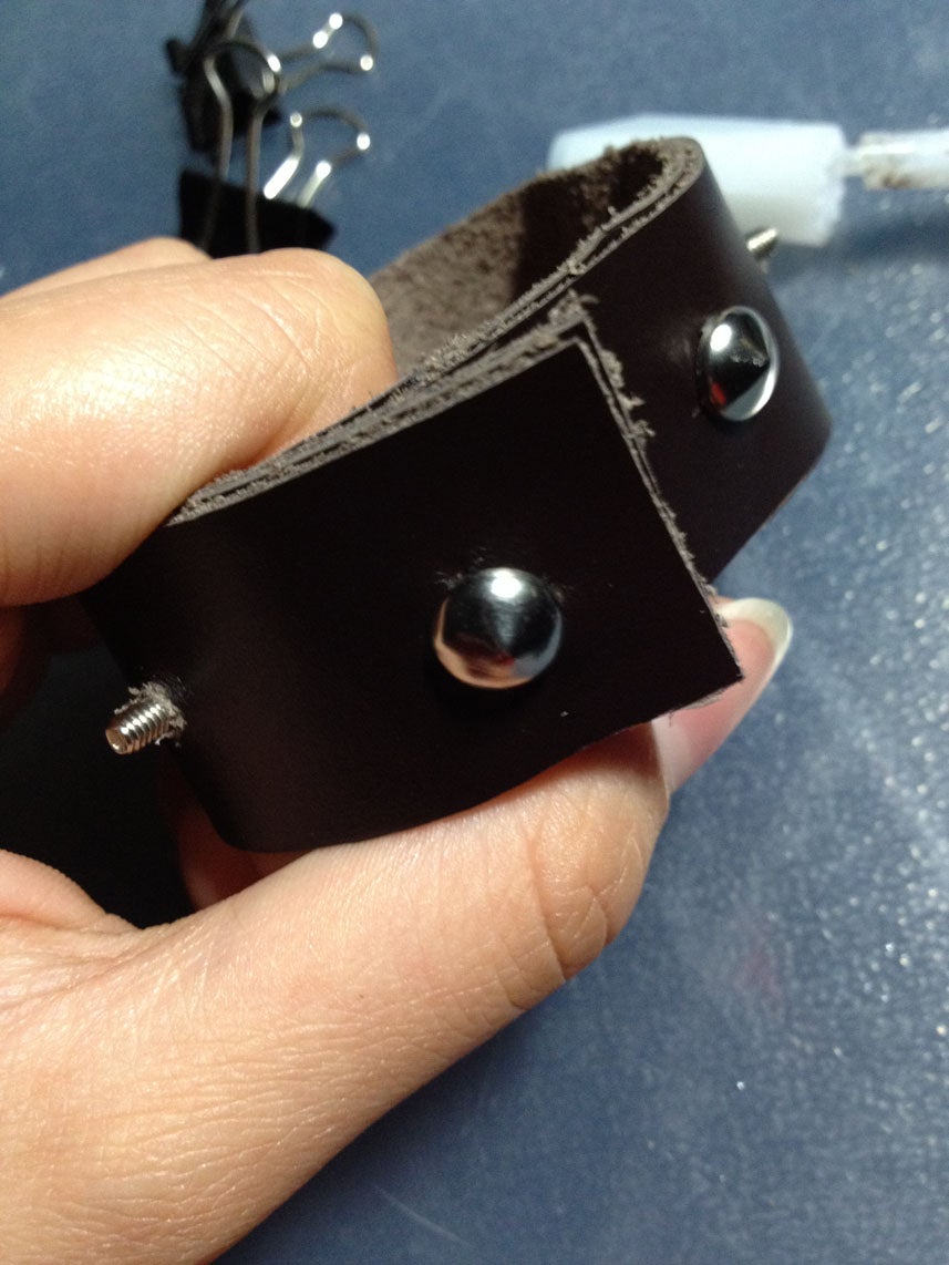 Sew the Female Half of Button on and Glue the Leather Above It