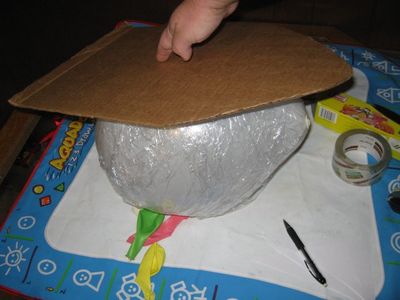 Build Up the Shape of the Shark Around the Balloon Using Cardboard