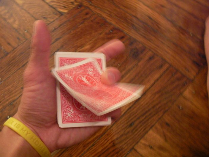 Deal/flick cards from a deck, with one hand