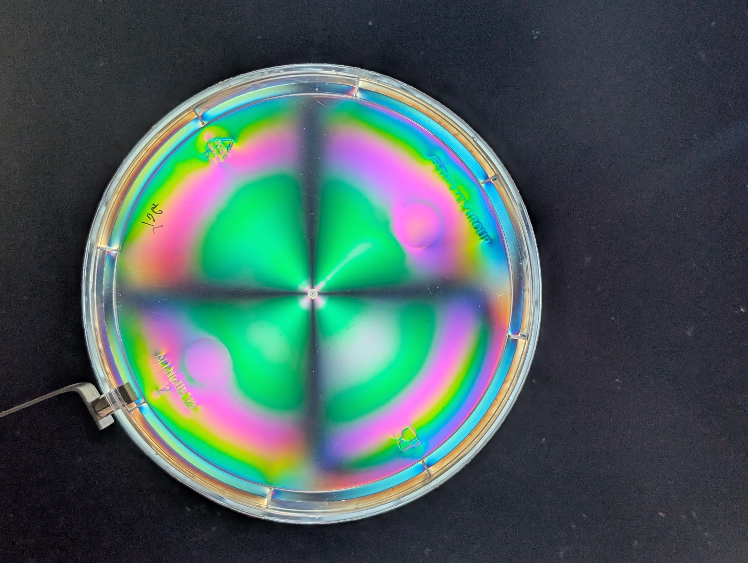 Polarisation Optics - Demo of Radial Birefringence in Yogurt Pots