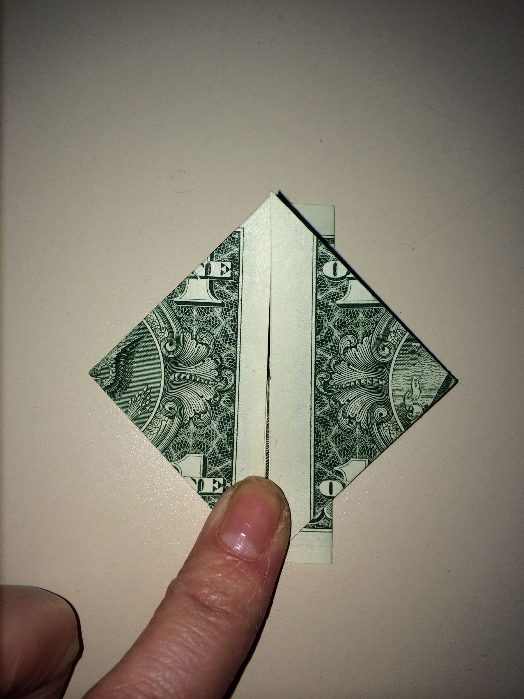 Dollar Origami Heart Holding Quarter : 11 Steps - Instructables