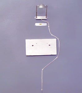 Measure and Mount Picture Light on the Wall Directly Above Where the Canvas Will Hang