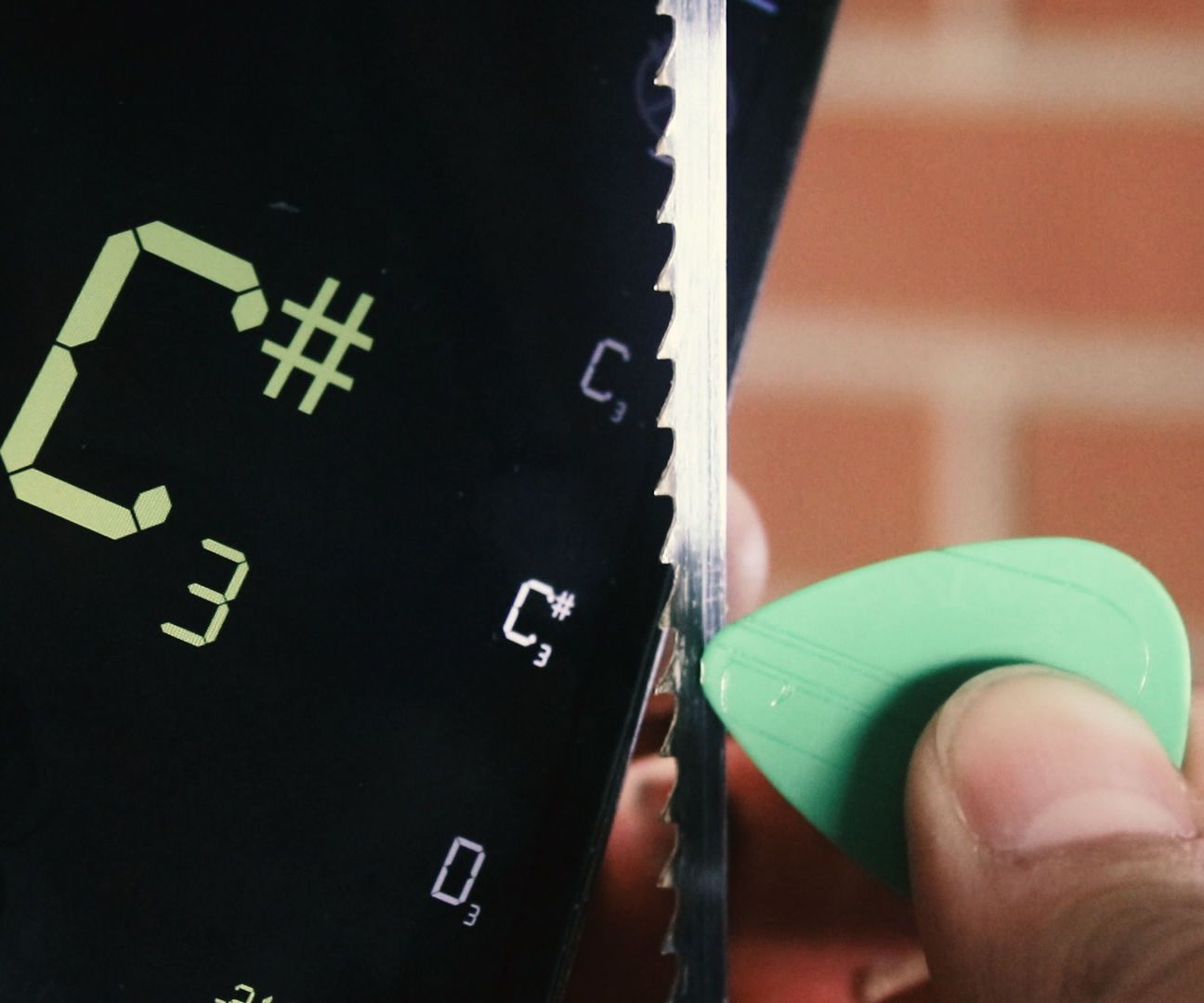 Adjust bandsaw blade tension with a guitar tuner!