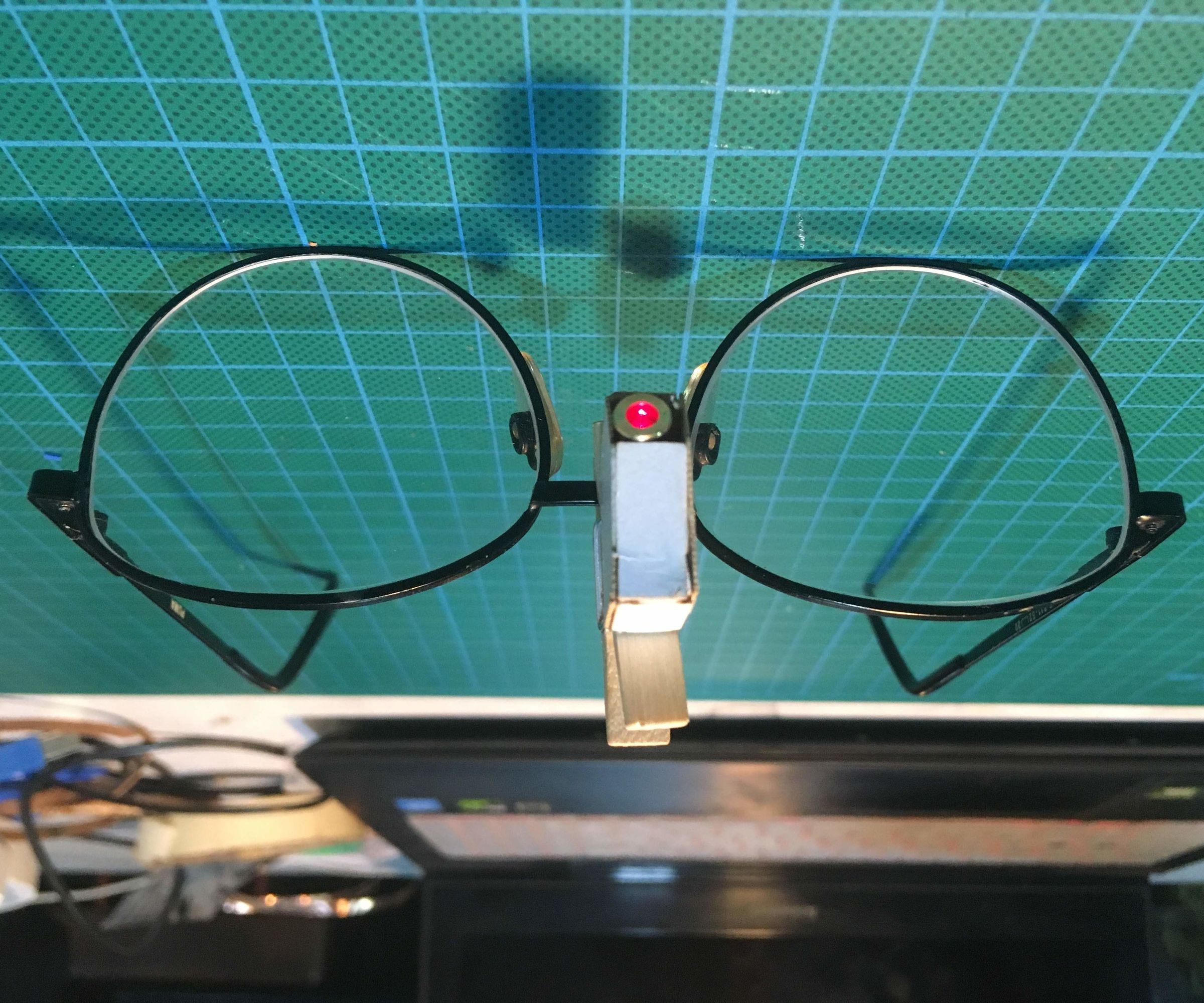 Spectacle-mounted Laser Pointer for Persons With Locomotor Disabilities