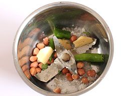 Take Groundnuts, Green Chili, Ginger, Sugar and Salt in a Small Jar of Mixer Grinder.