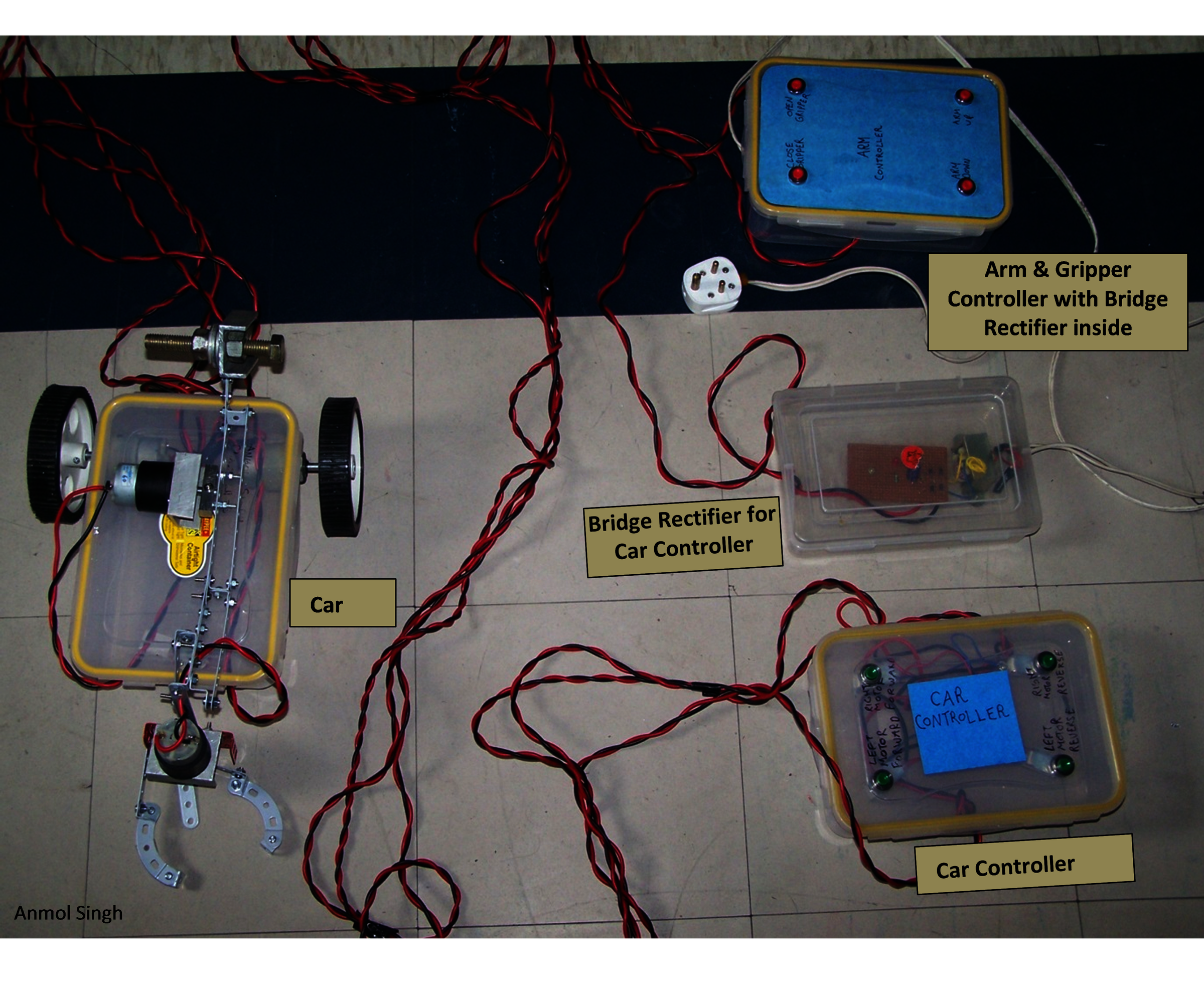 PUSH-BUTTON CONTROLLED CAR WITH ROBOTIC ARM