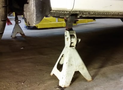 Loosen the Axle Nut and Jack Up the Car