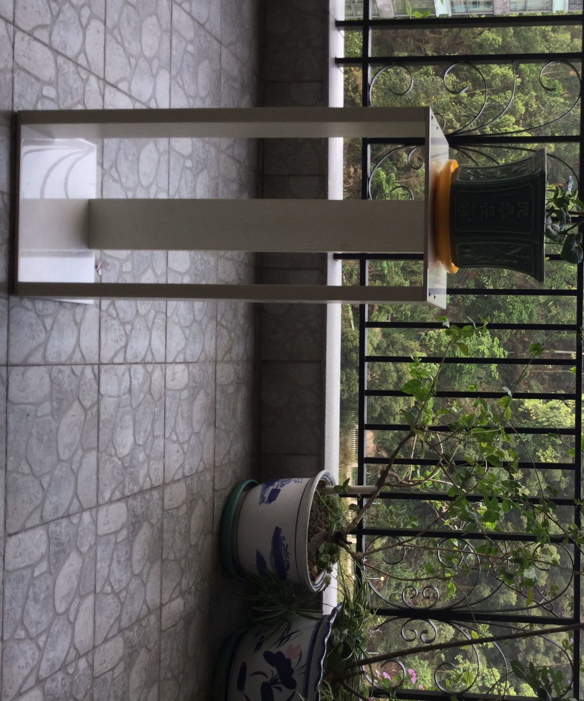 A Flower Rack Made of Tiles and Wood