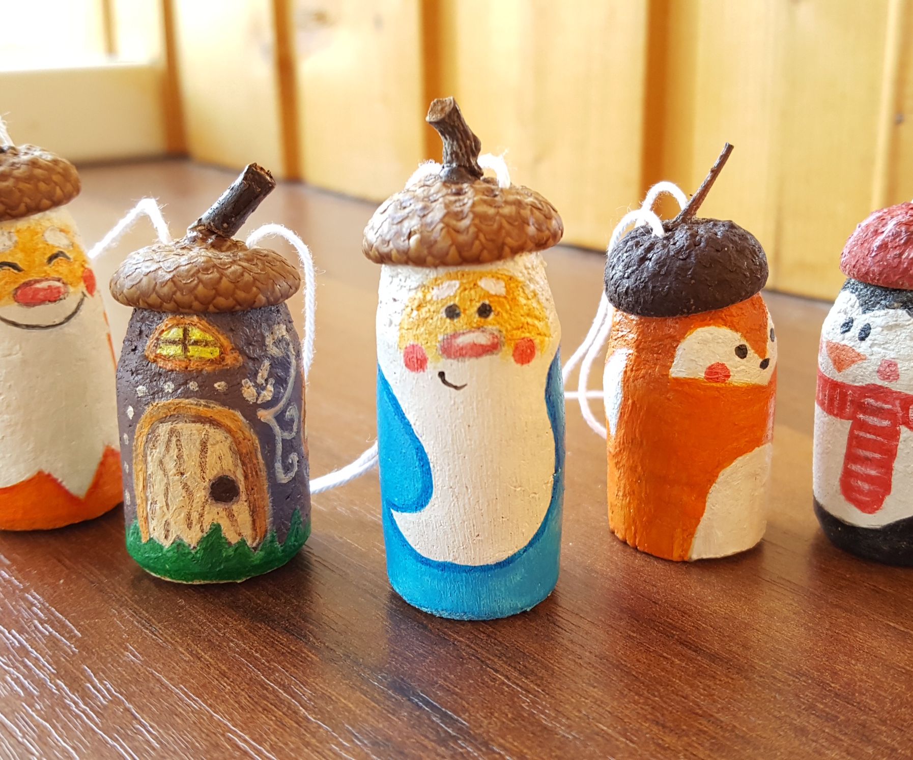 Miniature Christmas set out of wine corks and acorn caps. DIY