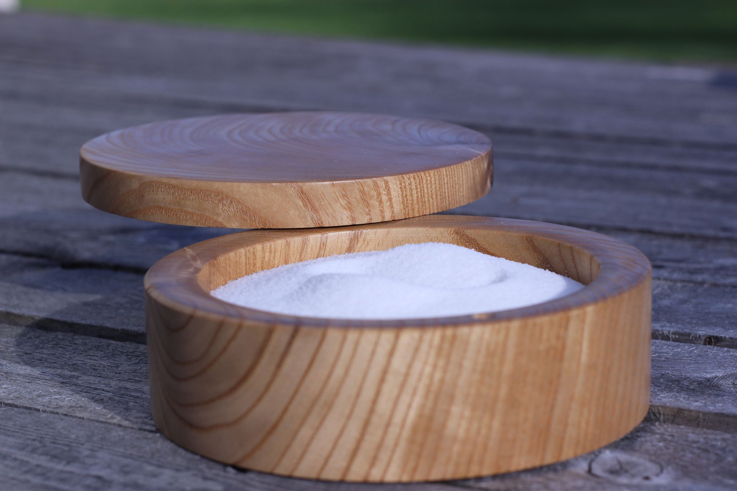 Salt Cellar With a Pivoting Magnetized Lid.