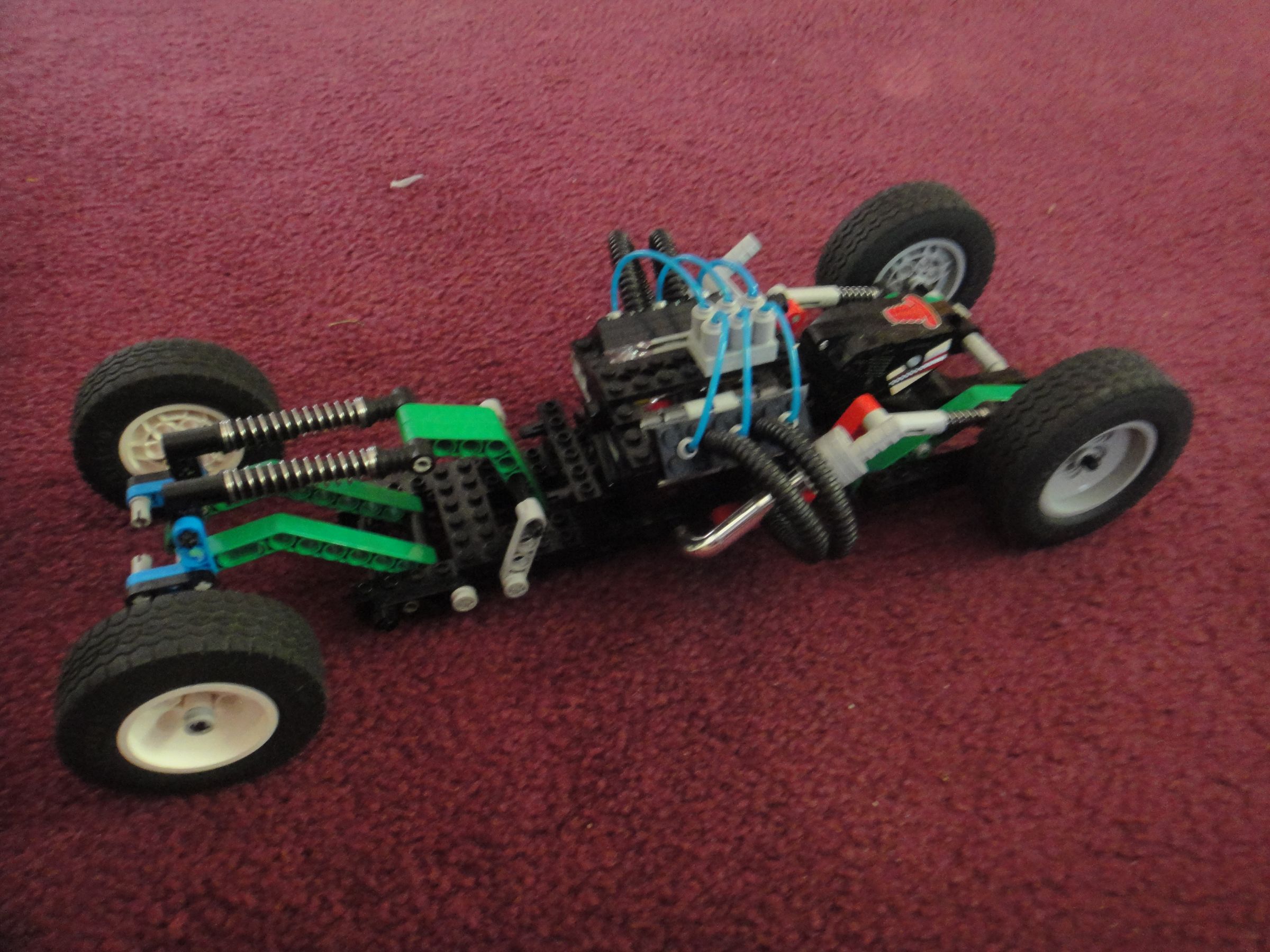 bare body lego car with rotating engine