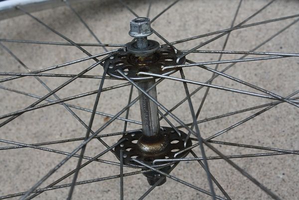 How to Rebuild a Bicycle Front Wheel Hub Using Simple Tools