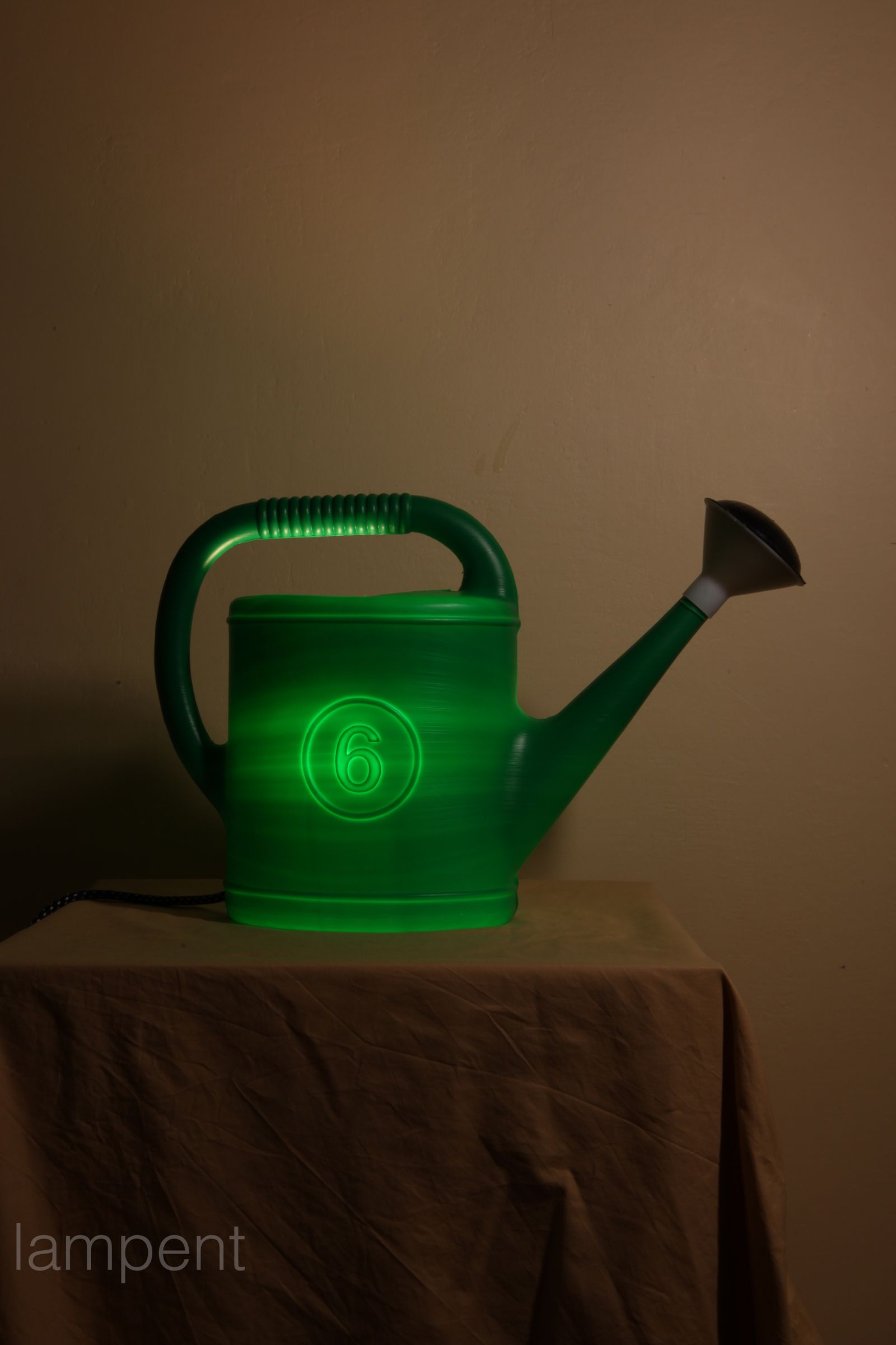 The watering pot-lamp.