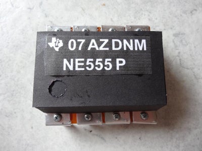 The Famous NE555 Timer-IC, Original and a Bit Larger