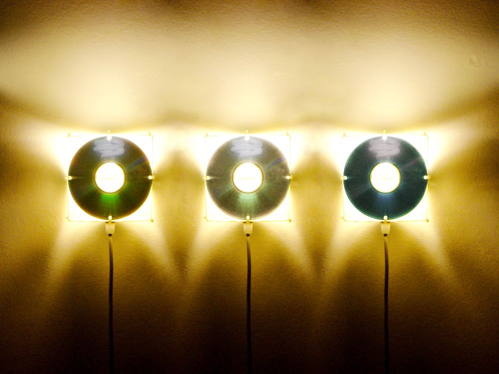 Multipurpose lamp with CDs/DVDs