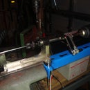 Semi-automatic spoke threading machine