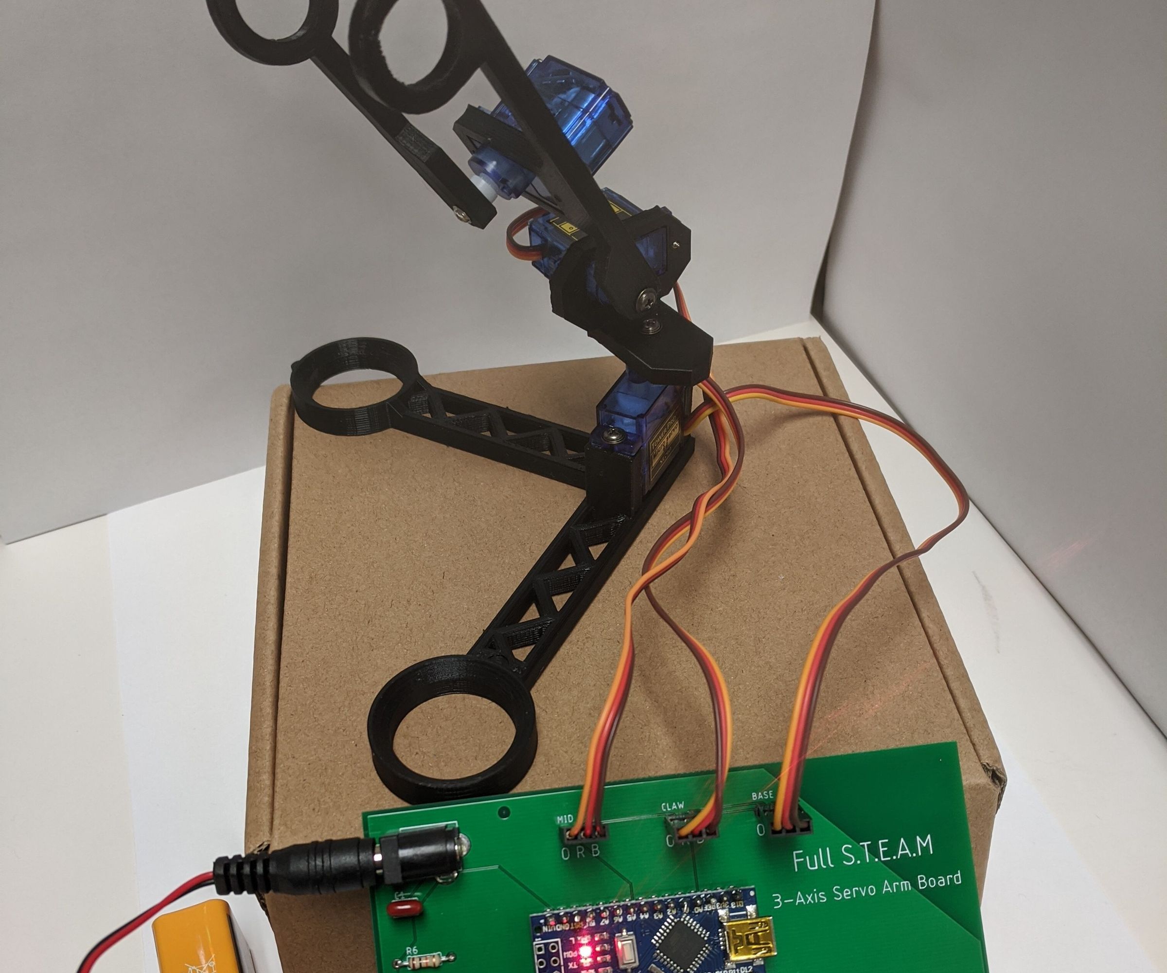 Simple Robot Arm with Lesson Plan for Circuits and Programming