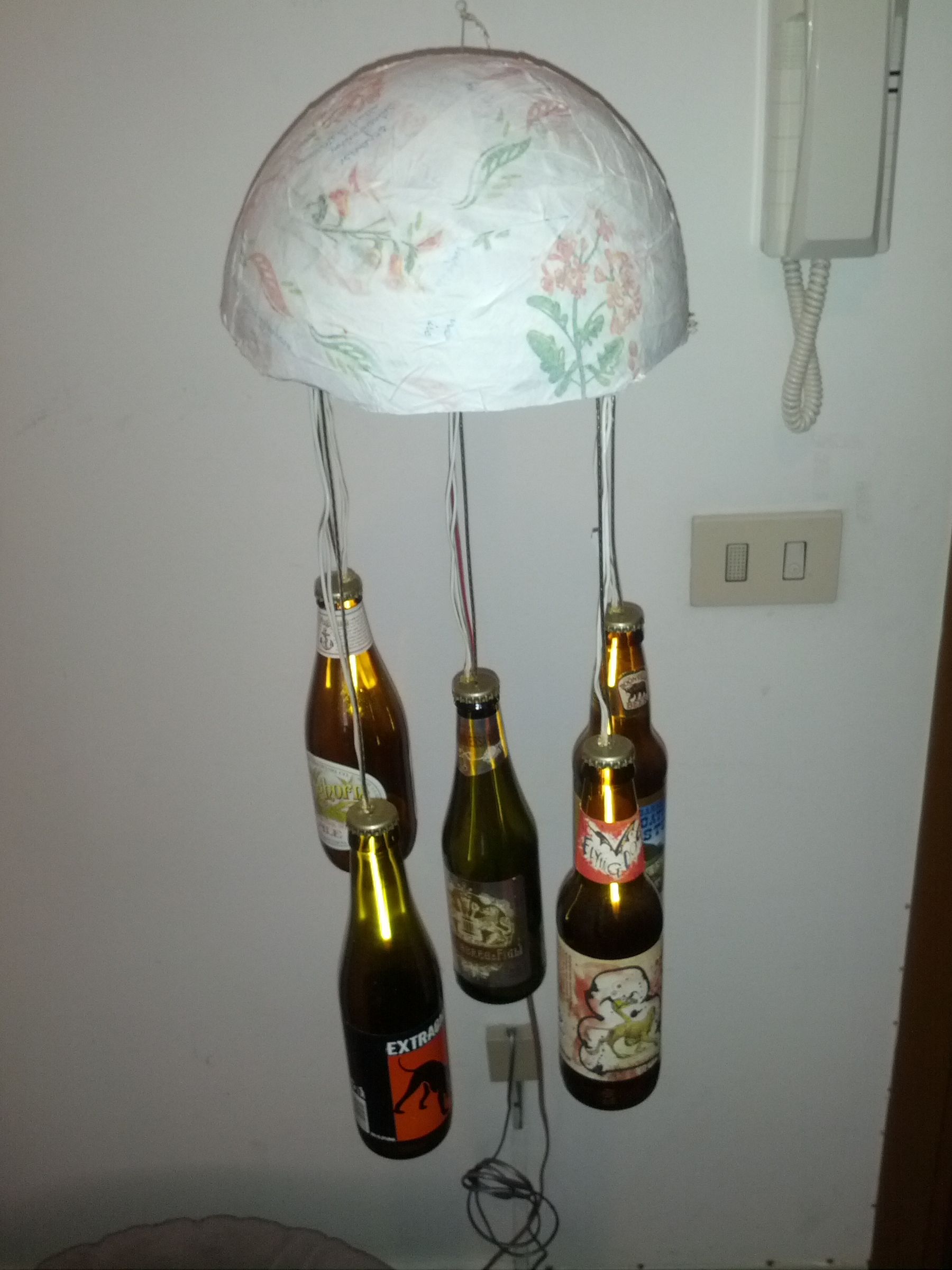 Hanging Bottles Chandelier From a Racket