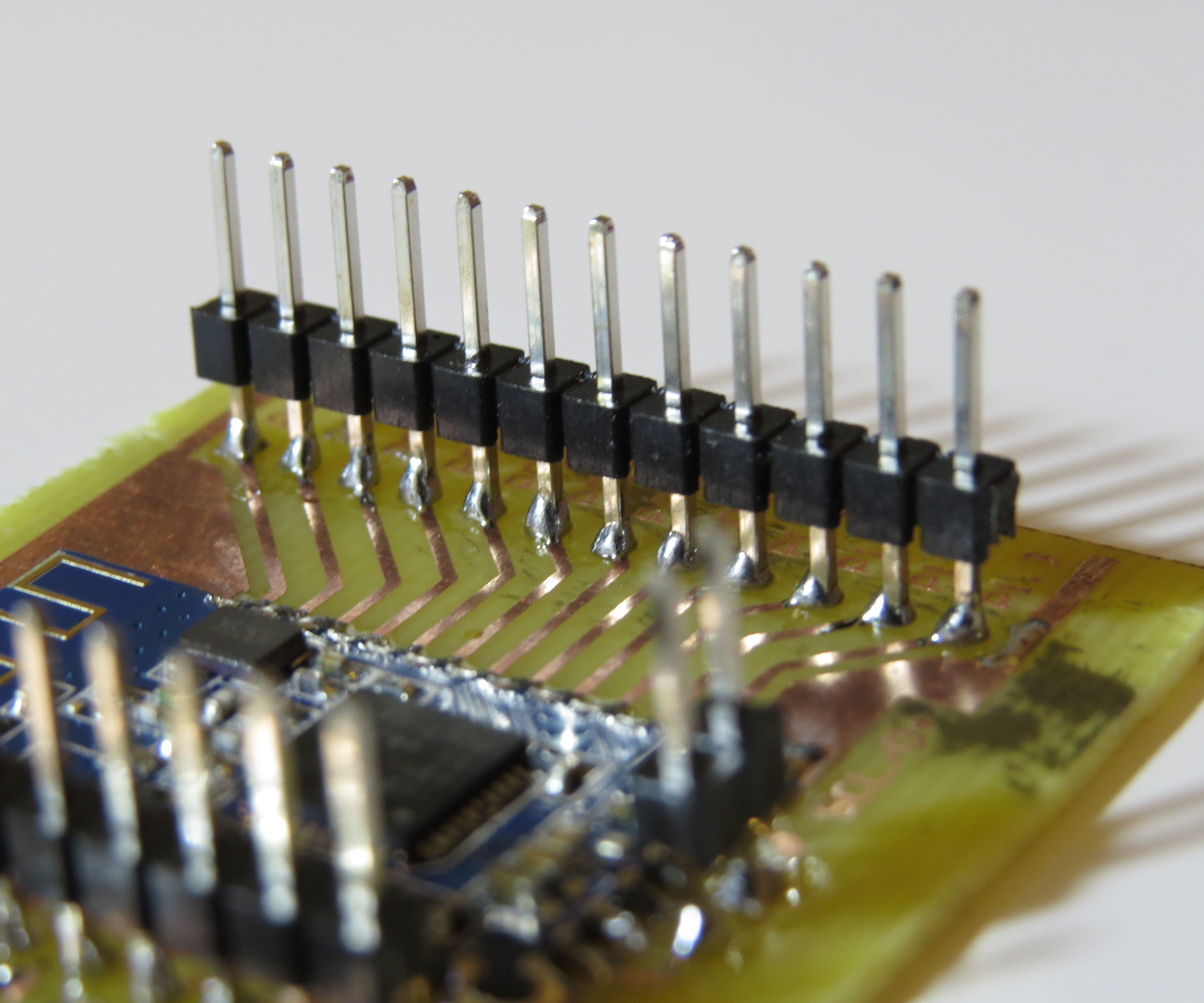Soldering headers without drilling holes