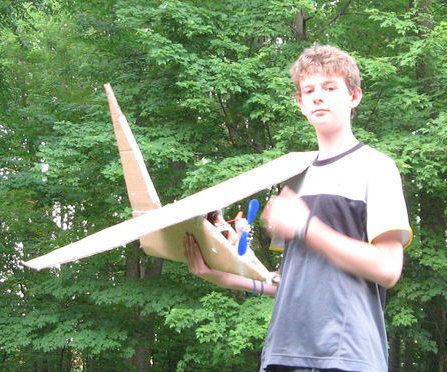 Huge cardboard airplane with propeller that is powerd by motor
