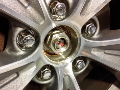 Loosen the Axle Nut and Jack Up the Car