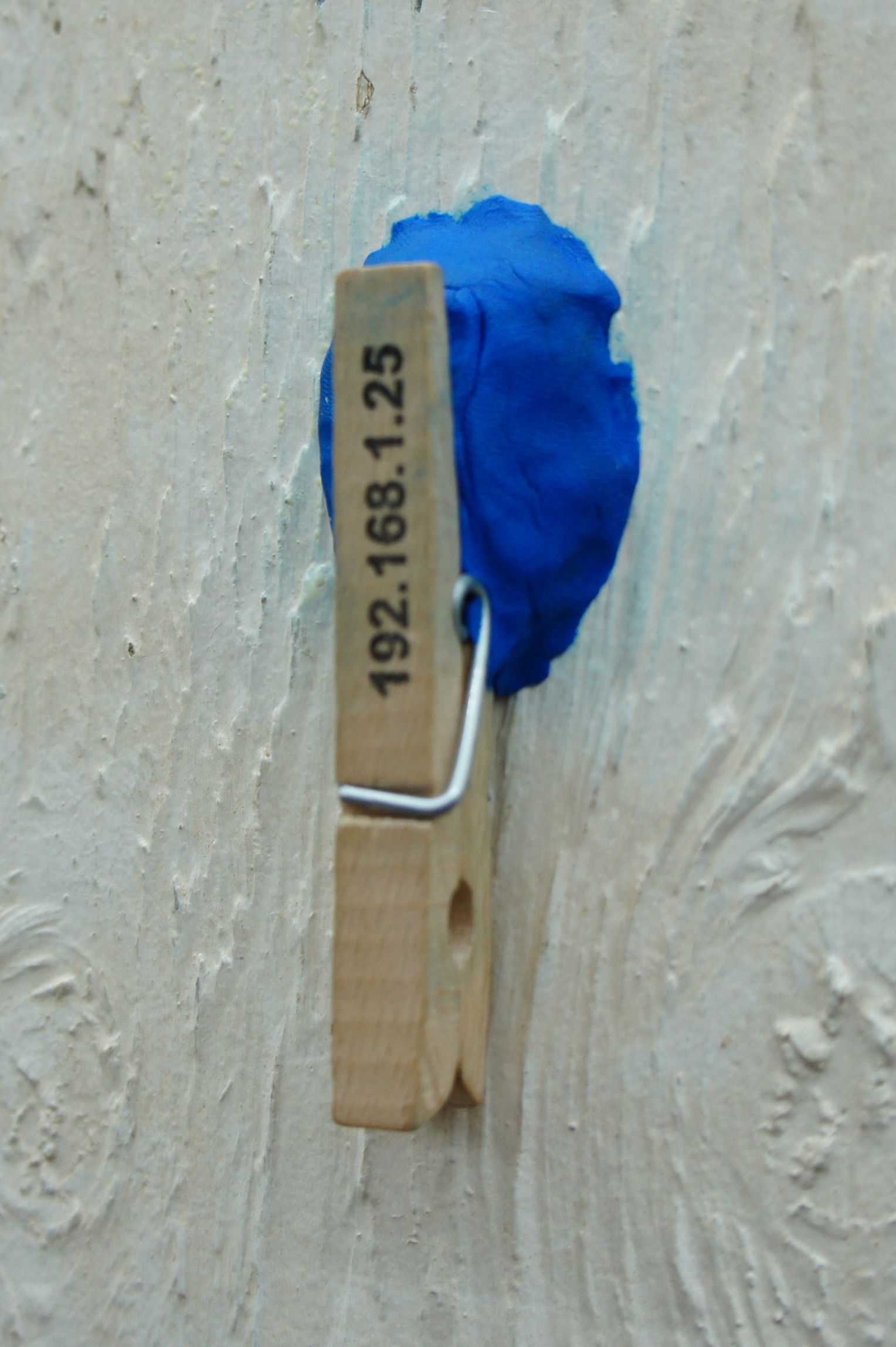 Sugru used to attach note clip to concrete wall