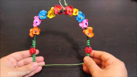 Wrapping the Swing With Flowers and Beads: