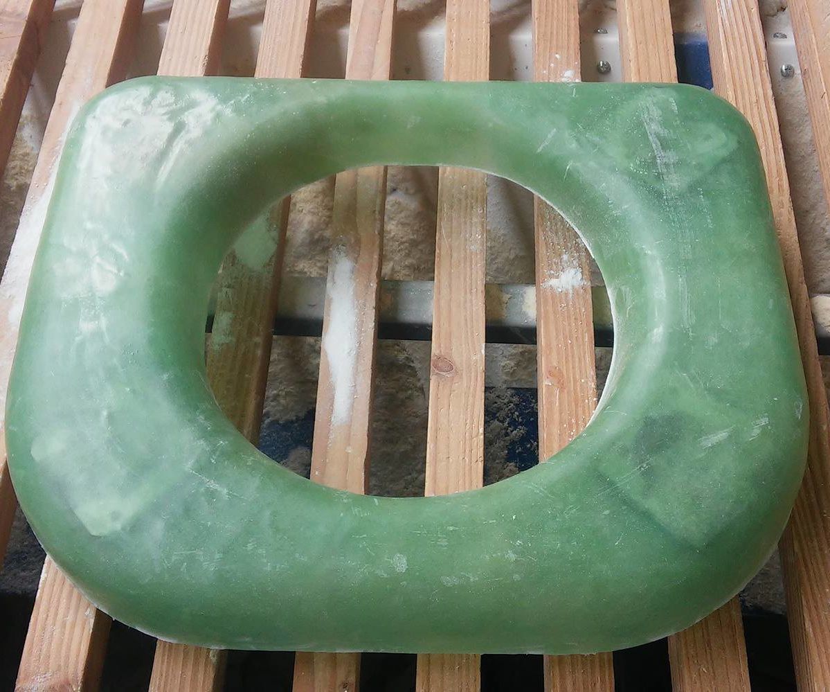 Hand-lay up toilet seat