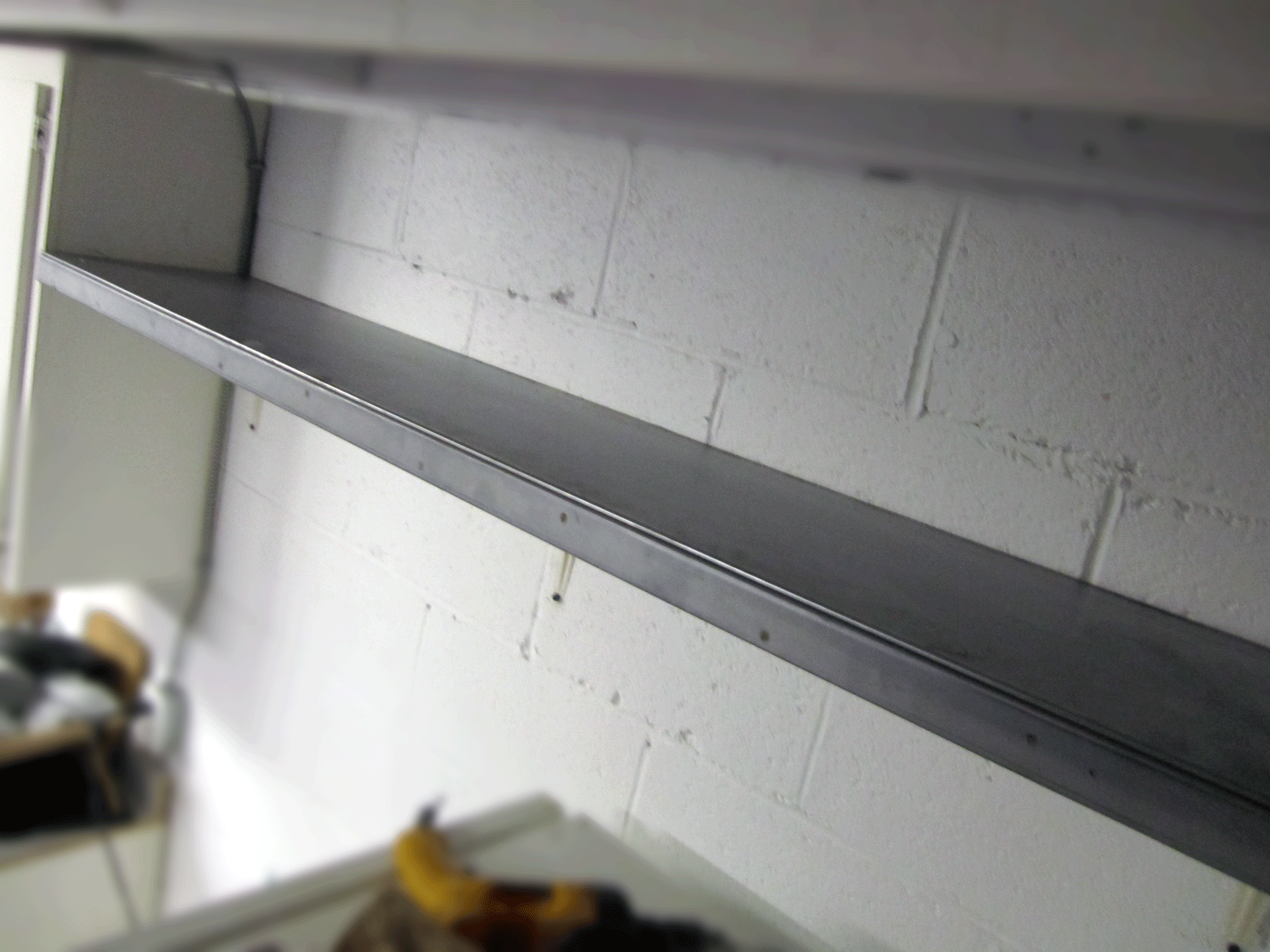 Build an Industrial-looking Shelf From a Metal Door