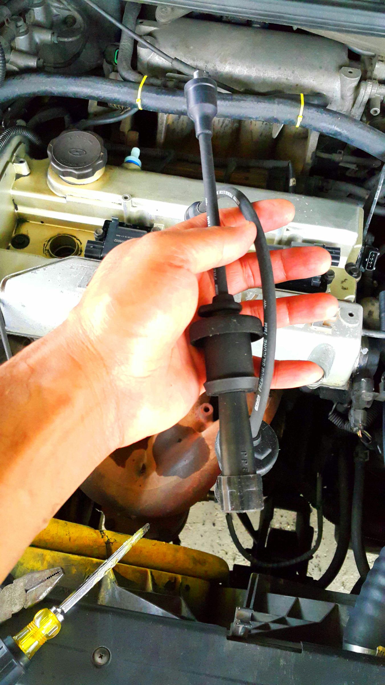 Replacing Coil Packs and Spark Plug Wires for Hyundai Trajet 2000. 3