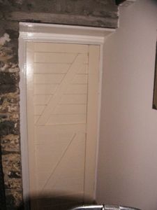 Door Made From an Old Church Pew Back.