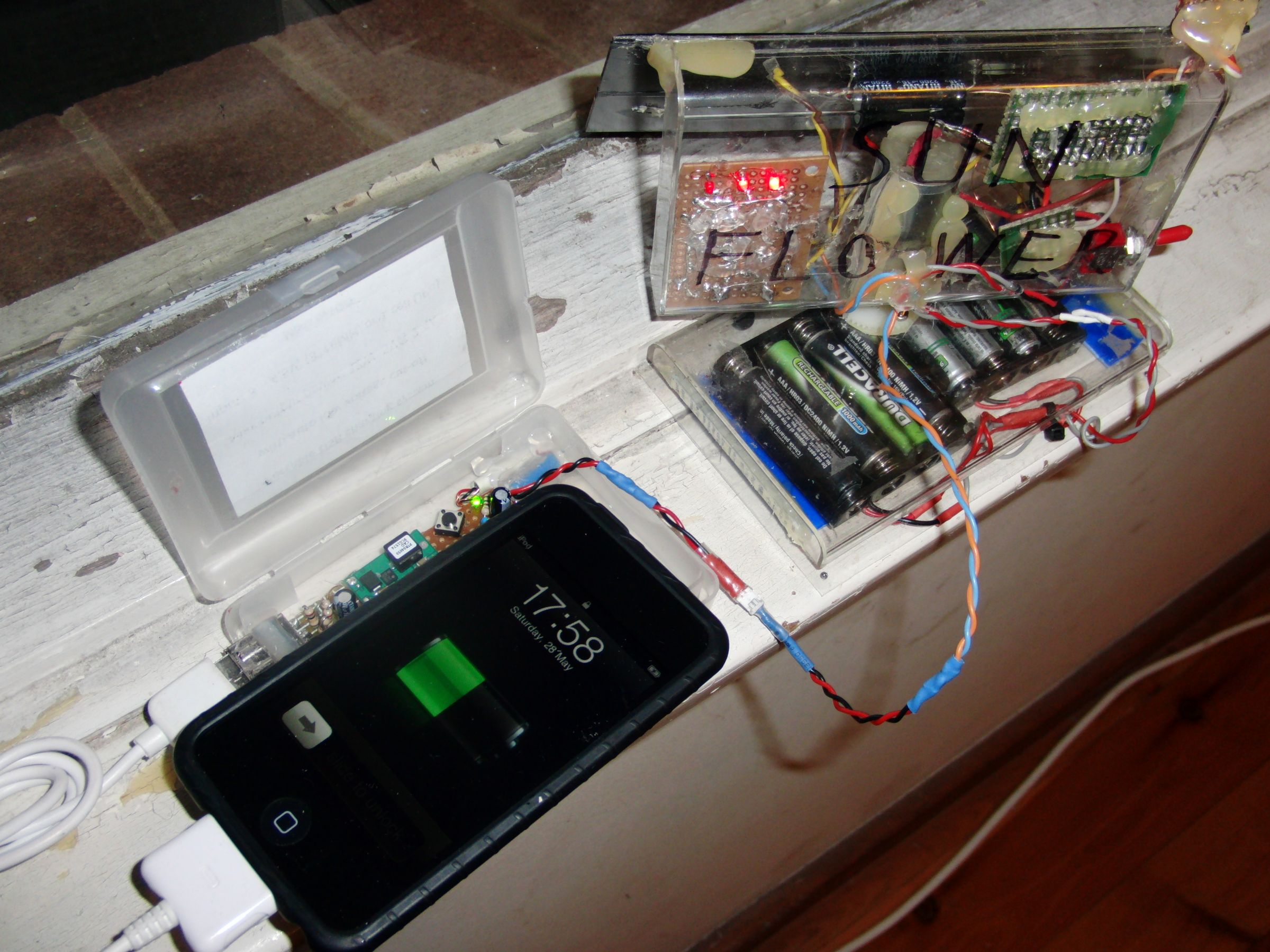 Solar phone charging system featuring sun tracking