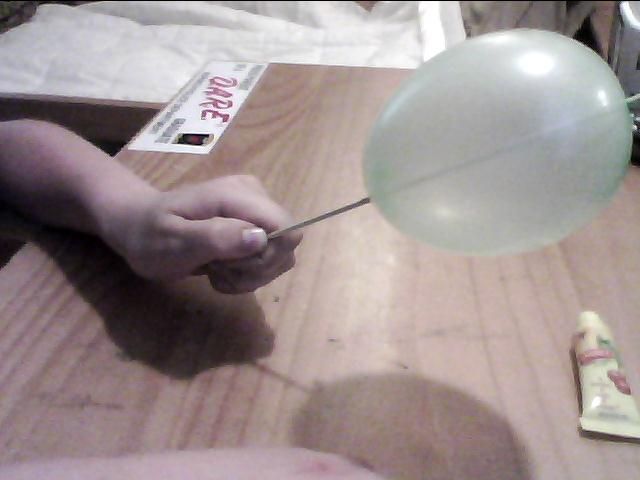 How to get a needle through a balloon