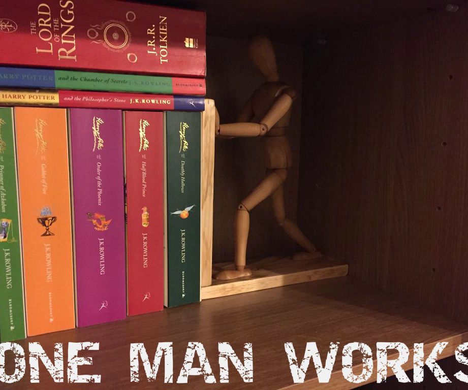 One Man Works While Another Relaxes.