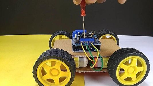 Attach the Motor Driver With the Arduino Uno & Connecting the Motor Wires With the Motor Driver: