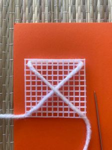 The Web Pattern With White and Yellow Yarn
