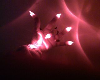 Finger Lights for Night Time Communication for the Deaf.