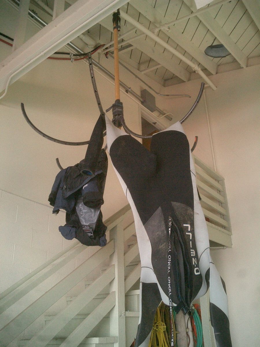 Wetsuit Hangers From Bicycle Rims.