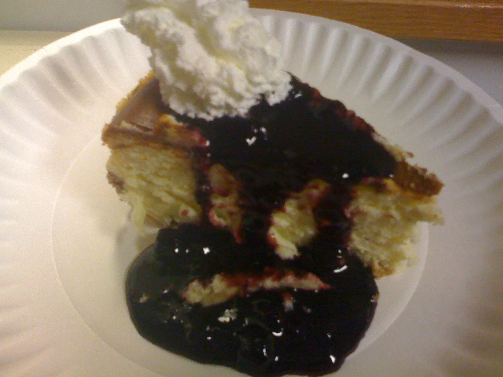Homemade Cheesecake With Pomegranate Blueberry Sauce