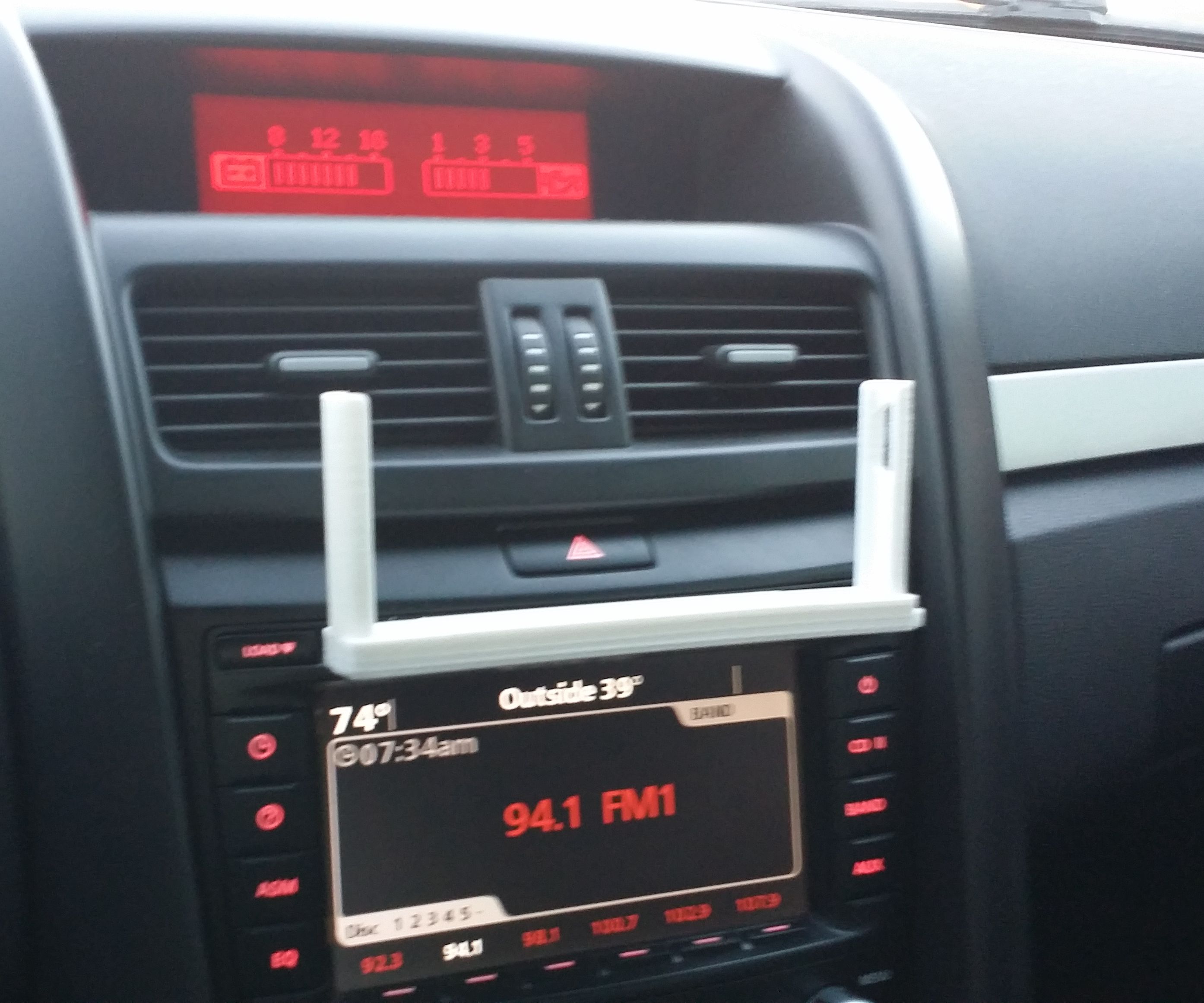 Universally Mounted Phone Holder. Can Fit Into CD-player Slot! and Other Places..