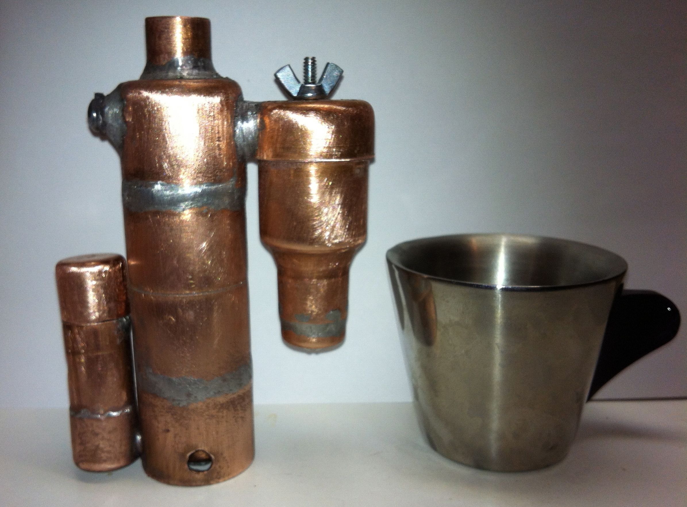 Pocket Size Espresso Machine With Integrated Alcohol Stove.