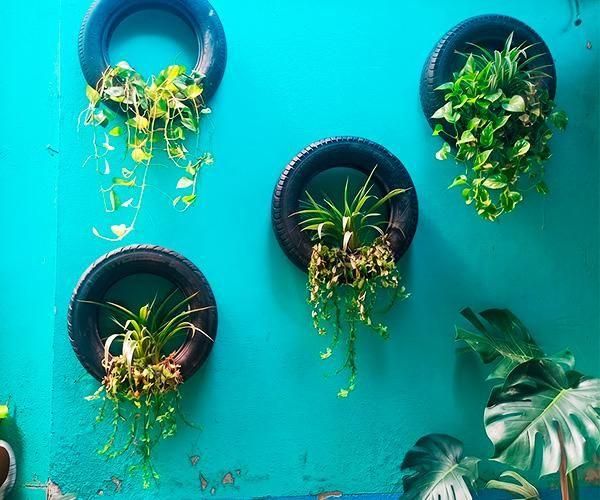 Staggered Tire Wall Planter: Upcycling Old Car Tires Into Vertical Gardens